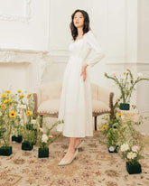 Silk midi dress with sweetheart neckline and long sleeves for romantic and refined elegance